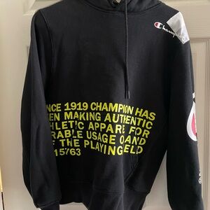 Champion Black Hoodie with Vibrant Yellow Print